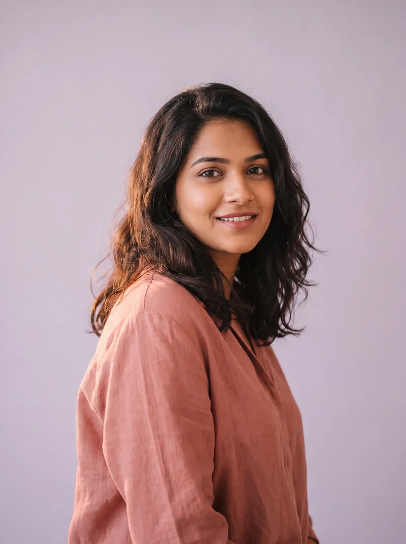 A young woman smiling at the camera.